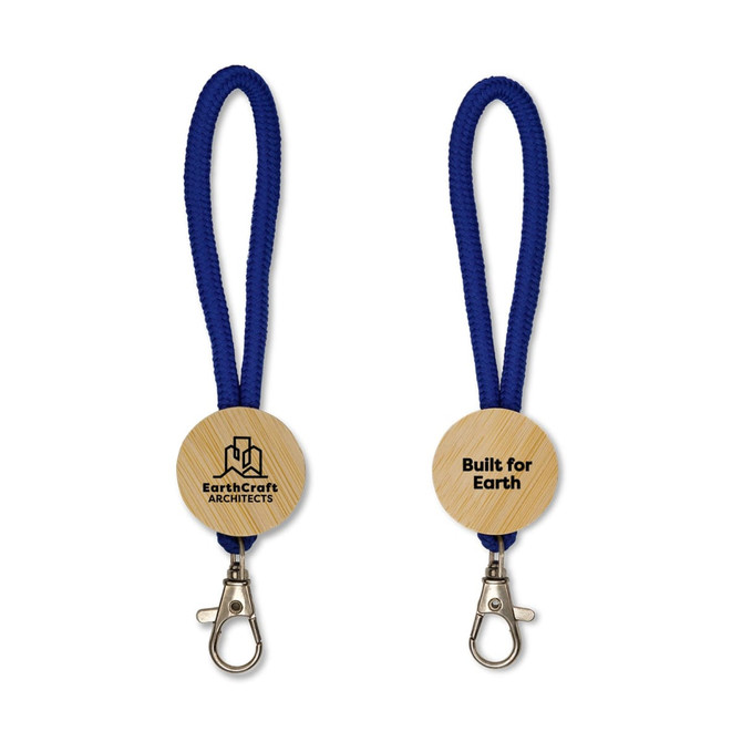 A wooden keytag with a blue fabric strap and a metal clip, featuring a branding logo on one side.
