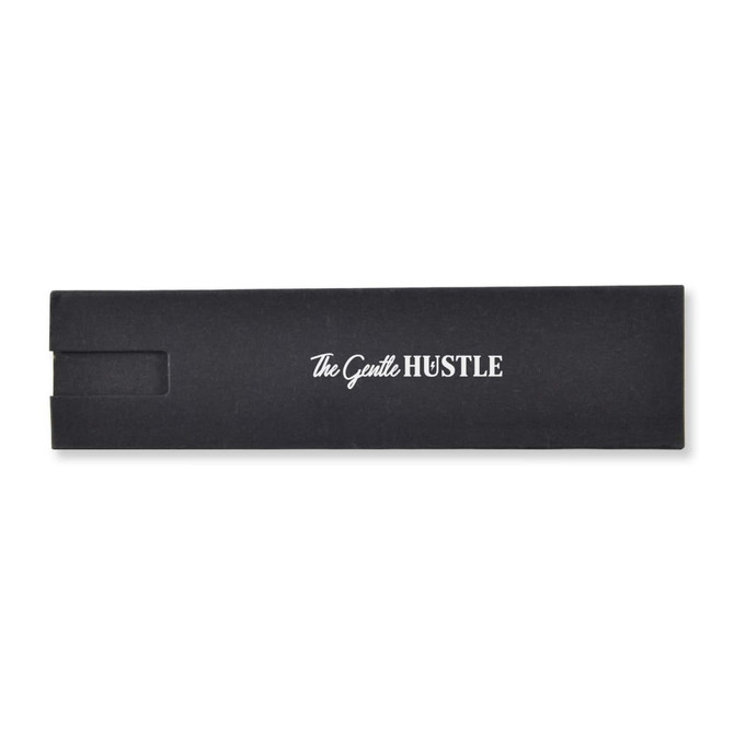 A black product box with a white logo. The design is sleek and minimalist, suitable for packaging.