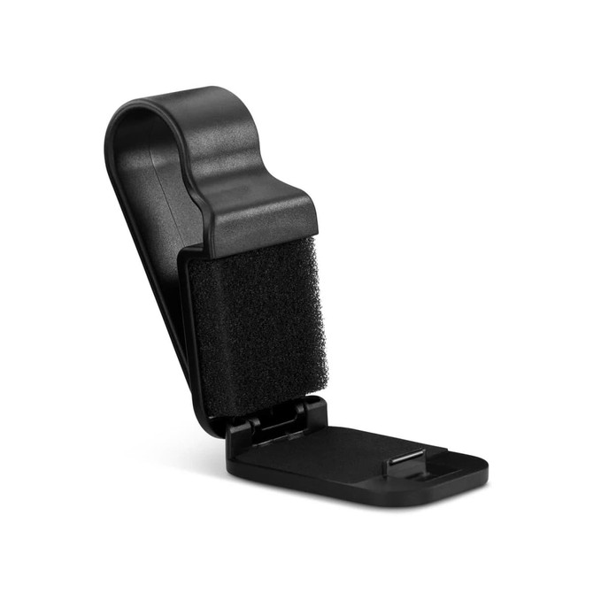 A black visor glasses holder with a secure clip and a textured grip pad for holding glasses or sunglasses.