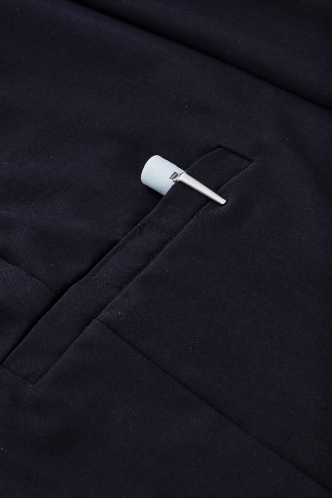 A navy women's comfort waist cargo skirt featuring a side pocket and a hanging tag.