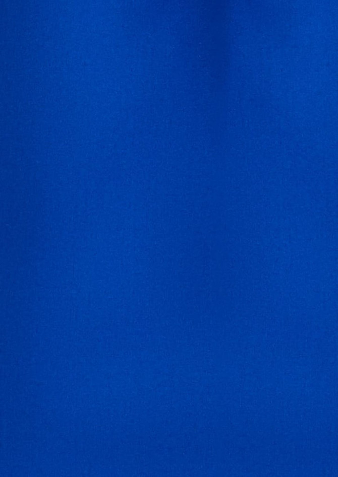A plain short sleeve shirt in vibrant blue, featuring a simple design and a brand logo.