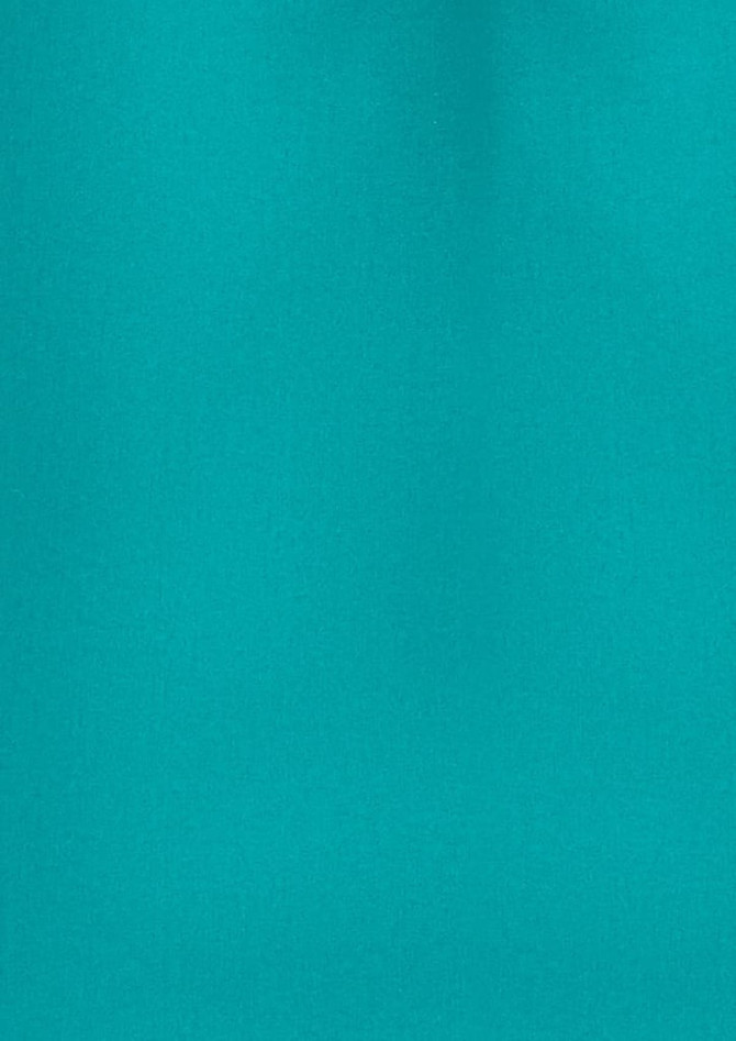 A plain short sleeve shirt in a vibrant teal colour with a logo visible.