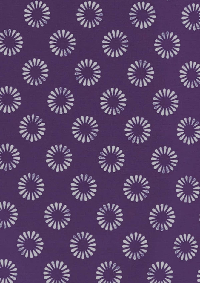 A purple tunic featuring a daisy print pattern in lighter shades. The design includes multiple floral motifs.