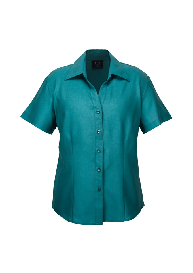 A short-sleeve button-up shirt in teal with a collar and a front button placket. It features a logo.