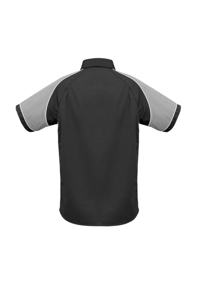 A short sleeve shirt in black with grey accents and contrasting piping, featuring a logo on the back.