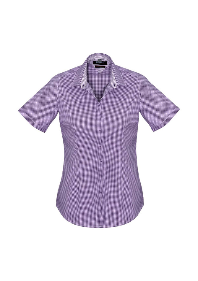 A women's short sleeve button-up shirt in a purple check pattern, featuring a collar and a logo.