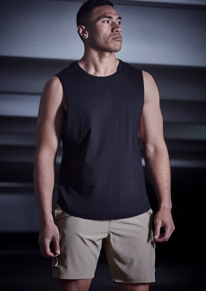 Men's Streetworx board shorts in khaki, paired with a black sleeveless top, featuring a logo.