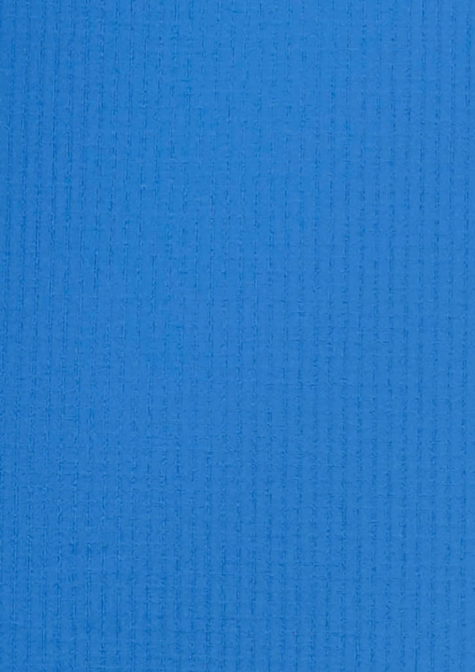 A blue, textured fabric showcasing a button-up shirt design. Features a logo in the corner.