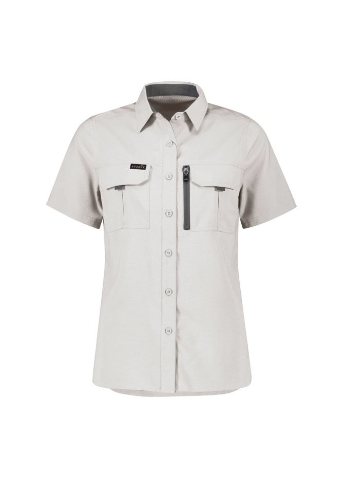 A women's short sleeve shirt in light grey with two front pockets and a zippered pocket, featuring a logo.