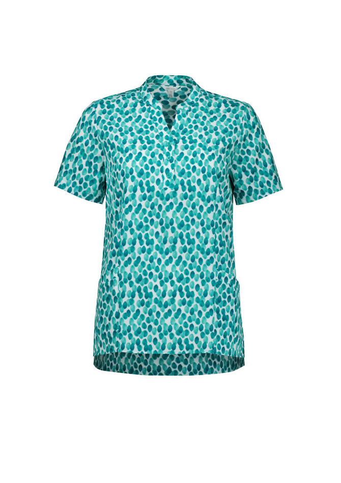 A short-sleeved tunic in a teal and white stardust print, featuring a collar and side pockets. It has a logo.
