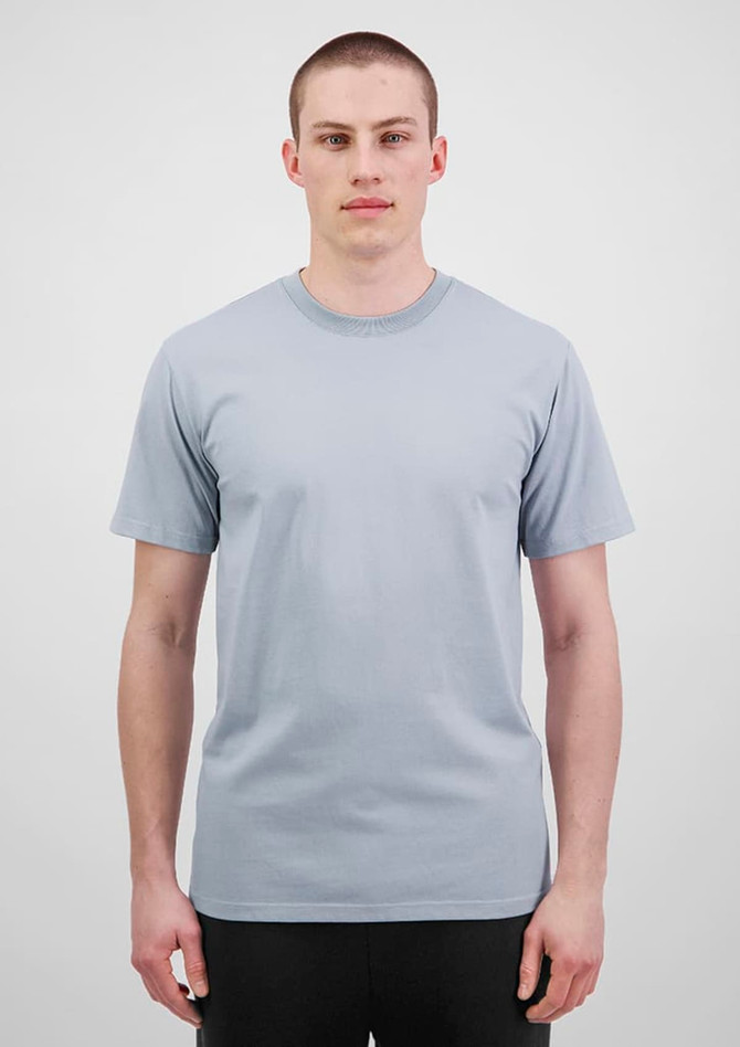 A light blue men's short sleeve tee displayed on a model against a plain background, featuring a logo on the chest.