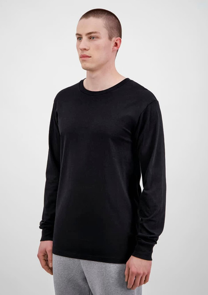 A black long sleeve men's t-shirt displayed on a model, featuring a simple design and fitted style.