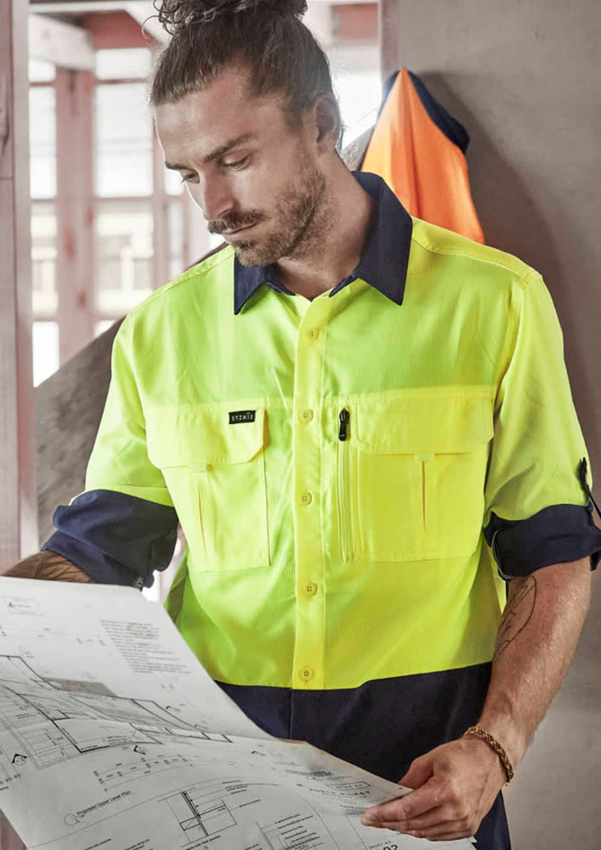 A high-visibility long sleeve shirt in fluorescent yellow and navy, featuring multiple pockets and a logo.