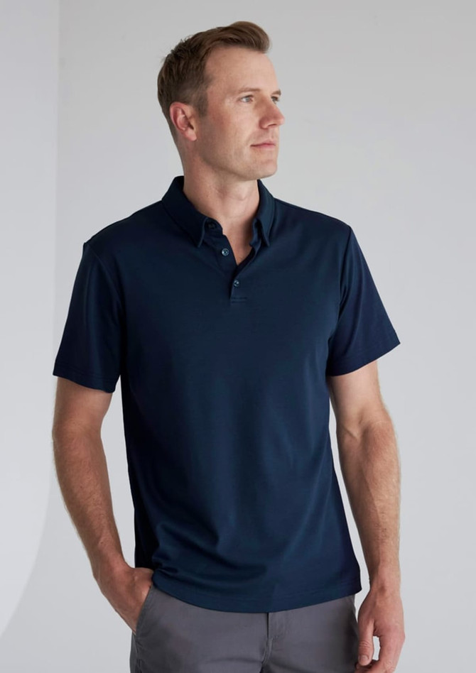 A navy blue short sleeve polo shirt with a collar, featuring a logo on the chest.