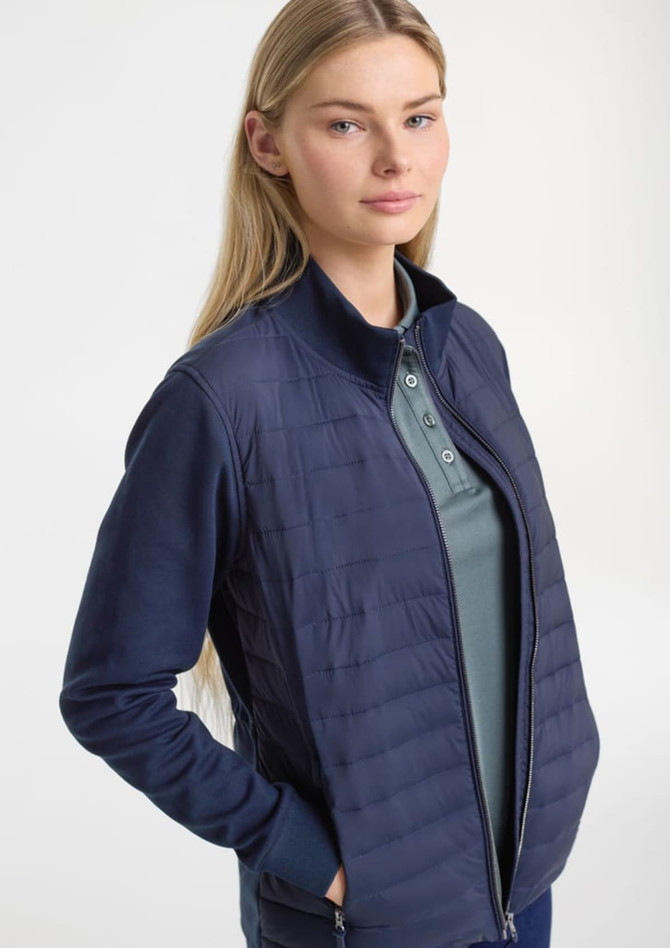 A women's tailor jacket in navy, featuring a zip front and a blend of quilted and smooth fabric.