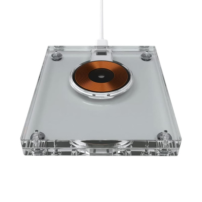 A wireless charger with a clear acrylic body and a circular copper charging pad. It includes a white charging cable.