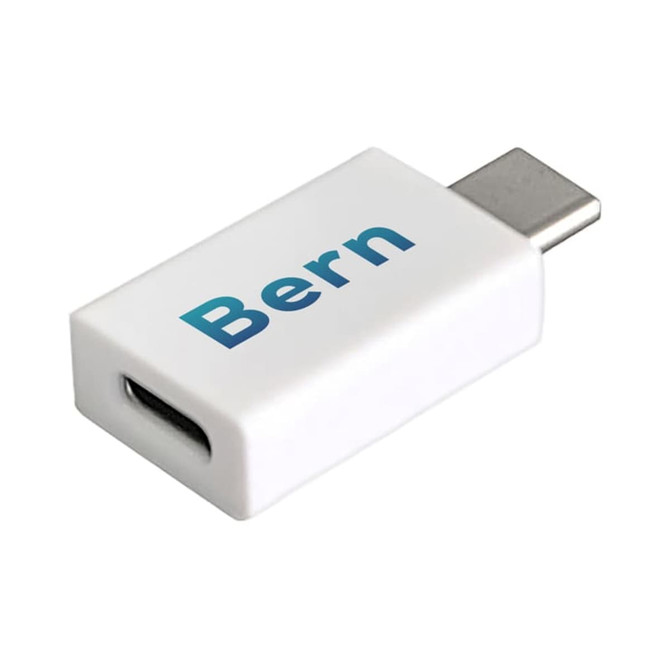 A white Type-C to Type-C data blocker with a logo. The device has a compact design suitable for tech use.