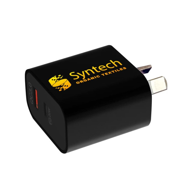 A black wall charger with a USB port, featuring a logo on one side and a prong for plugging in.