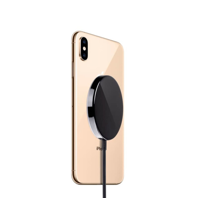 A black MagSafe iPhone case attached to a gold iPhone, showcasing its sleek design.