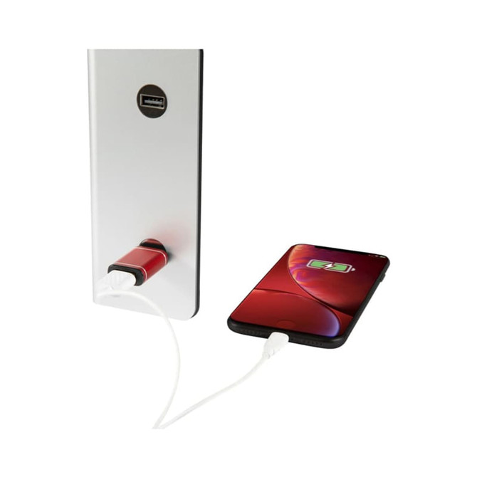 A silver USB data blocker attached to a charger, connected to a smartphone displaying a charging icon.
