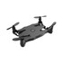 A foldable black drone with four propellers and a compact design, featuring a logo on top.