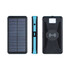 A solar-powered wireless power bank in black and teal, featuring solar panels on one side and a textured surface.