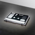 A grey and black laptop organiser featuring various compartments and a logo, resting on a dark surface.