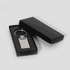 A silver keychain displayed inside a black box. The keychain has a rectangular shape with a polished finish.