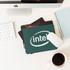 Three fabric mouse mats in various designs and colours, including one with an Intel logo.