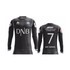 A long sleeve soccer jersey in black featuring a vertical striped pattern and a logo on the sleeve.