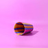 A drink bottle featuring a vibrant, multi-coloured swirl design in yellow, pink, and blue, with a smooth finish.