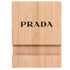 A bamboo phone holder in a natural wood finish featuring a logo on the front.