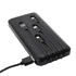 A black power bank with three ports and a USB charging cable. It has a logo on the surface.