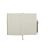 An A5 notebook with lined pages, a tan cover, and a matching pen. It has a ribbon bookmark and an elastic band.