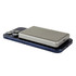 A silver MagSafe wireless power bank rests on a dark phone. The power bank has charging ports and a brand logo.