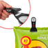 A collapsible silicone pet food scoop in black and grey, with an integrated bag clip for storage.