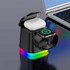 A black 4-in-1 wireless charger with a colourful base, featuring slots for AirPods and an Apple Watch, beside a laptop.
