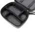 A grey toiletry bag with a zippered closure, featuring multiple inner compartments and a sleek black interior.