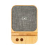 A wireless charger featuring a bamboo base and grey fabric surface, designed for eco-friendly charging.