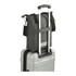 A black laptop tote made from recycled material, sitting atop a silver suitcase with extending handles.