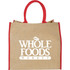 A large jute tote bag in natural colour with red handles, featuring a logo on the front.