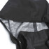 A black softshell jacket featuring a patterned interior and a hood, with a visible brand logo.