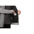 A grey men's knit zip hoodie featuring an inner pocket, held open by a hand. The fabric appears soft and comfortable.