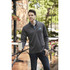 A grey men's quarter zip jumper featuring a branding logo, paired with dark jeans and a coffee cup.