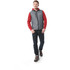 A man walks in a grey down vest over a red hoodie, paired with dark jeans and hiking boots. The vest has a logo.