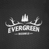 A textured, black fabric displaying a logo with trees and antlers, featuring the words "Evergreen Woodwild."