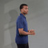 A men's eco polo shirt in navy blue, featuring a collar and short sleeves, with a logo on the chest.