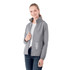A woman wearing a grey packable rain jacket with a hood, featuring a logo and text on the front.