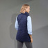 A women's insulated puffer vest in navy, featuring a lightweight, packable design and a branded logo.