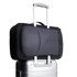 A black Bellroy Lite Travel Pack 30L backpack resting on a silver suitcase, featuring a textured panel and a logo.